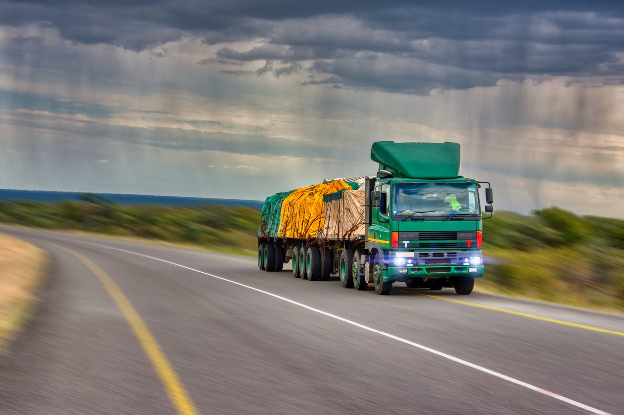 Haulage truck on a Nigerian highway carrying goods between states