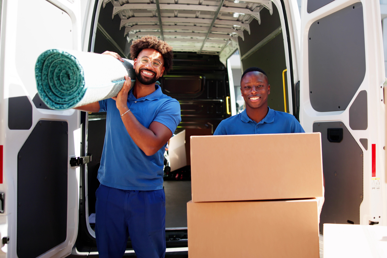 Moving van being loaded with boxes for a house move in Nigeria