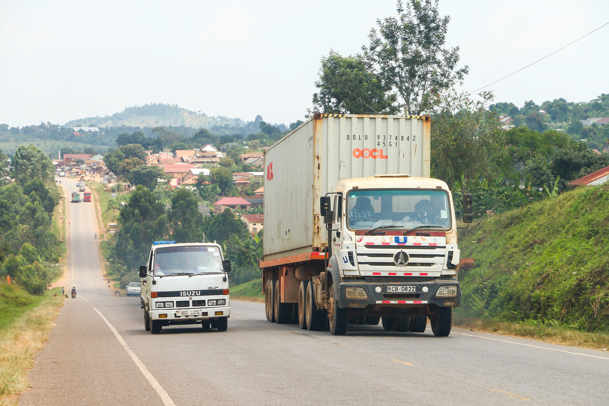 Cargo truck on a West African highway carrying goods from Nigeria to Ghana